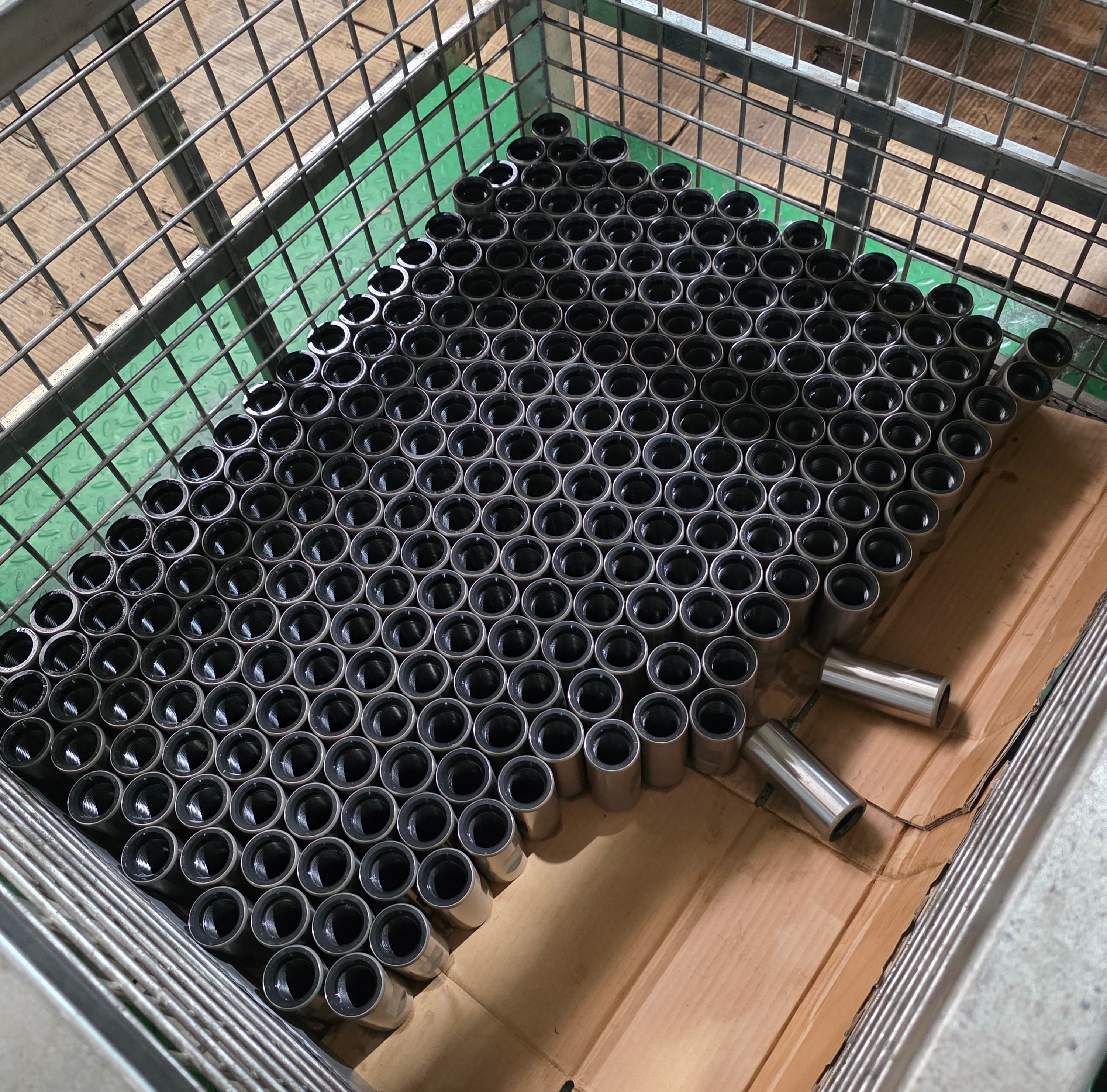 Sucker rod couplings in workshop